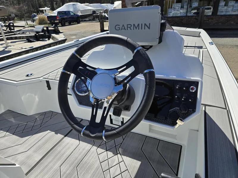 Slide: The Image of Steering wheel of 2025 Avid 20 Vertex boat with Garmin navigation system. - 15