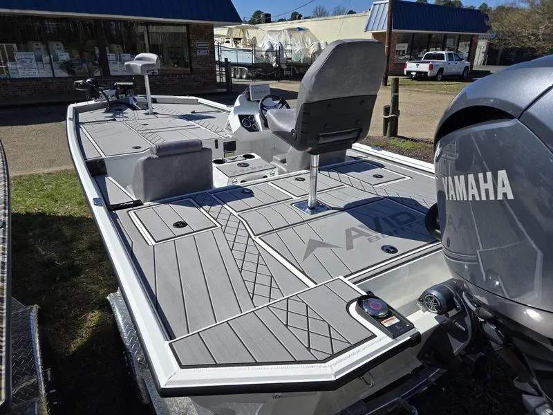 Slide: The Image of 2025 Avid 20 Vertex boat with Yamaha engine, featuring spacious deck and seating. - 18