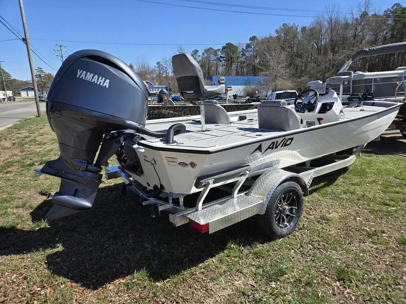 Slide: The Image of 2025 Avid 20 Vertex boat with Yamaha motor on trailer, parked on grass. - 3