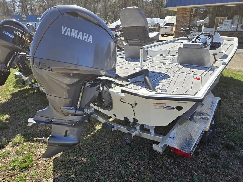 Slide: The Image of 2025 Avid 20 Vertex boat with Yamaha outboard motor on trailer, parked outdoors. - 7