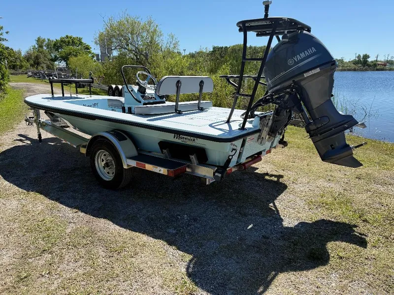 Slide: The Image of 2025 Maverick HPX 17 HPX-S boat with Yamaha motor on trailer by a lake. - 23