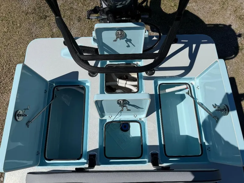 Slide: The Image of 2025 Maverick HPX 17 HPX-S boat storage compartments, open and empty, viewed from above. - 6