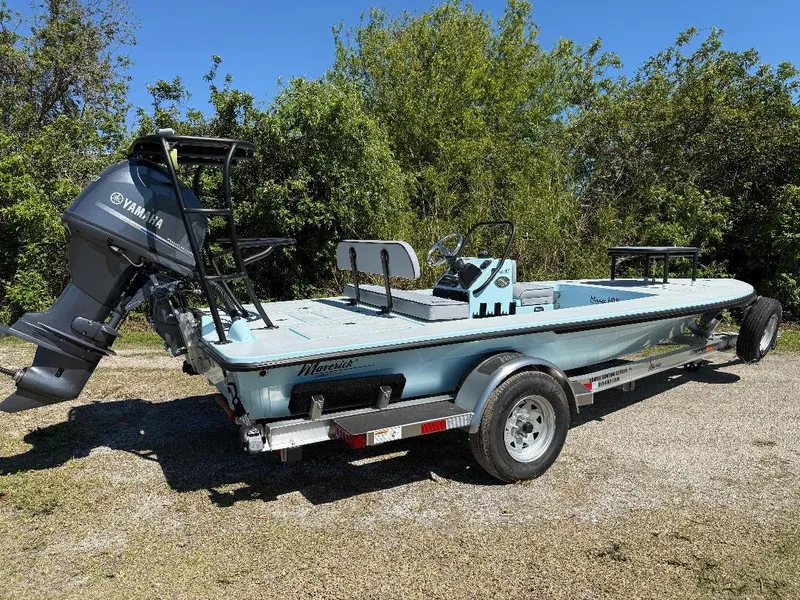 Slide: The Image of 2025 Maverick HPX 17 HPX-S boat on trailer, featuring Yamaha outboard motor, parked outdoors. - 8