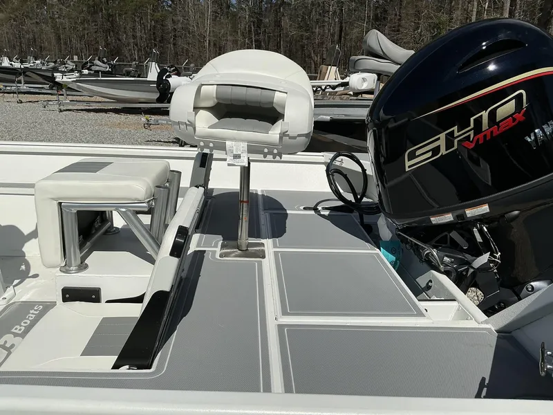 Slide: The Image of 2025 G3 Bay 20 boat interior with Yamaha SHO VMAX engine, featuring seating and deck. - 12