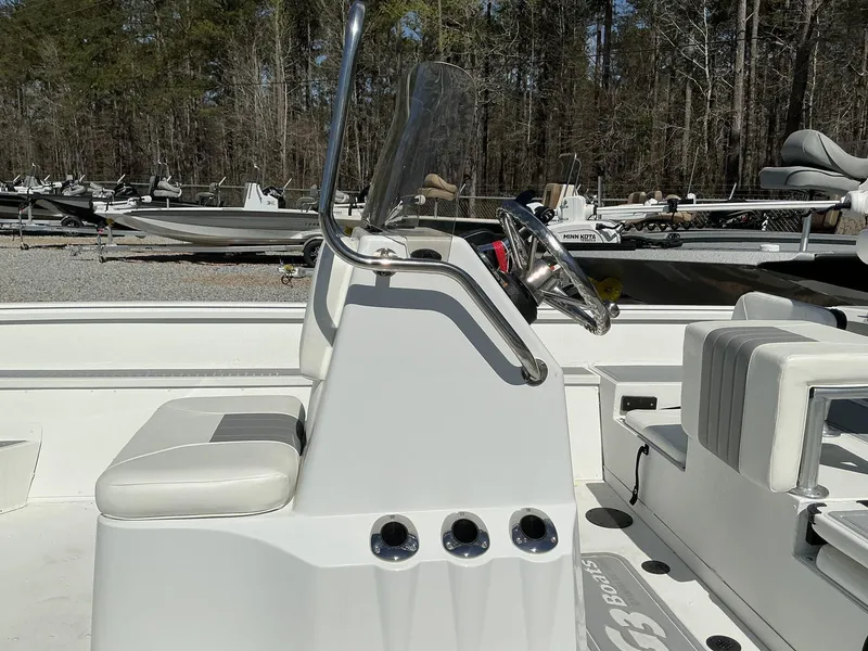 Slide: The Image of 2025 G3 Bay 20 boat interior with steering console and seating. - 5