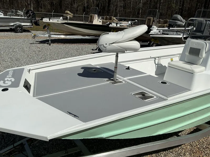 Slide: The Image of 2025 G3 Bay 20 boat with seating, displayed outdoors on gravel. - 8