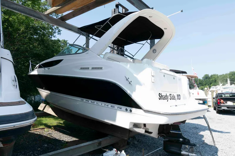 Slide: The Image of 2008 Bayliner 285 boat on trailer in Shady Side, MD, under sunny skies. - 3