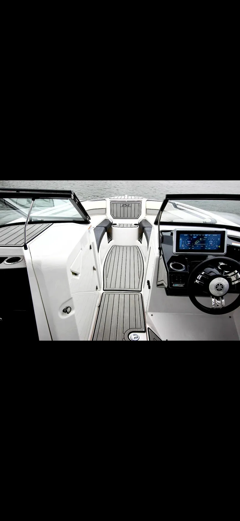 Slide: The Image of 2023 Yamaha Boats 252SD interior with modern dashboard and sleek design. - 16