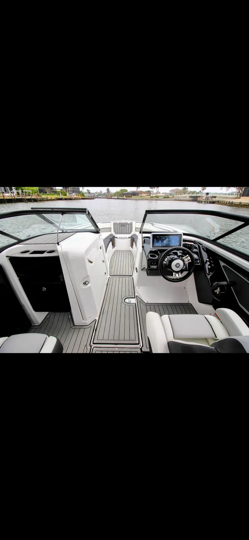Slide: The Image of 2023 Yamaha Boats 252SD interior with modern dashboard and steering wheel. - 18