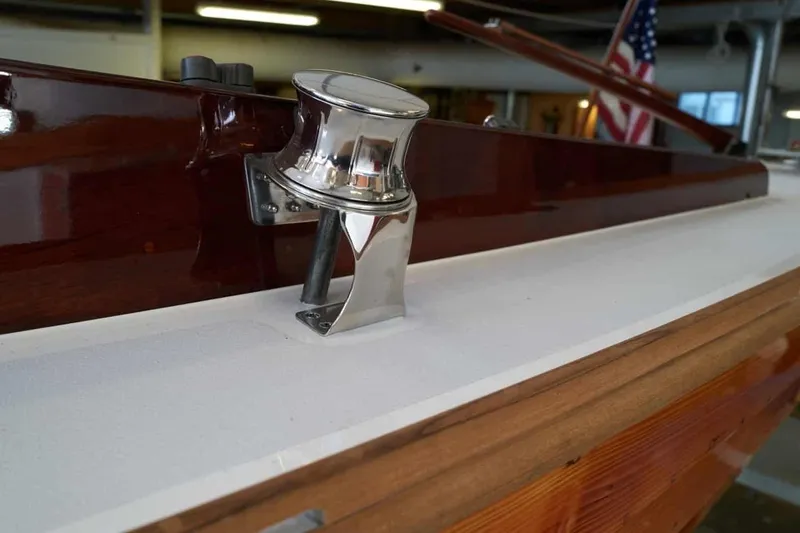 Slide: The Image of 1979 Nordic Folkboat deck with polished chrome fitting and wooden trim. - 11