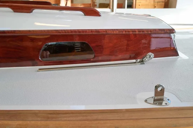 Slide: The Image of 1979 Nordic Folkboat with polished wood and sleek design details. - 13