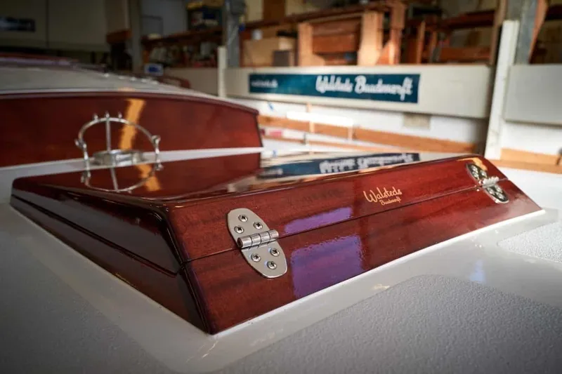 Slide: The Image of Polished wooden hatch on a 1979 Nordic Folkboat, showcasing craftsmanship and design. - 15