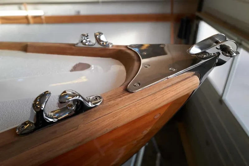 Slide: The Image of Close-up of 1979 Nordic Folkboat's polished metal fittings and wooden deck detail. - 16