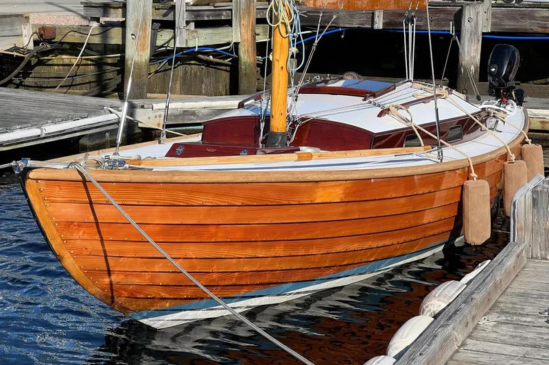 Slide: The Image of Vintage 1979 Nordic Folkboat with wooden hull docked at marina. - 3