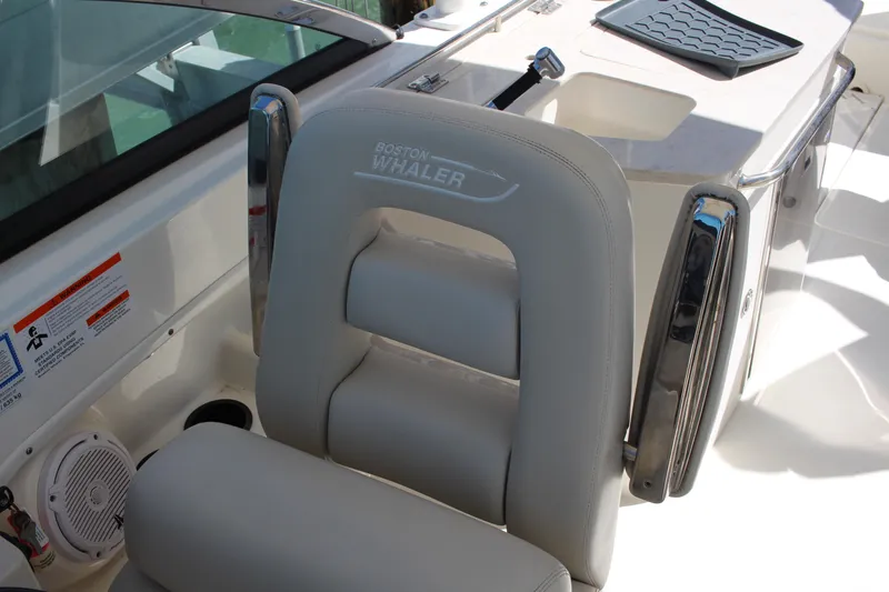 Slide: The Image of Boston Whaler 270 Vantage 2014 boat seat with logo and chrome accents. - 10