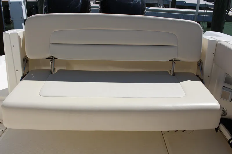 Slide: The Image of 2014 Boston Whaler 270 Vantage boat seat, beige upholstery, rear view. - 13