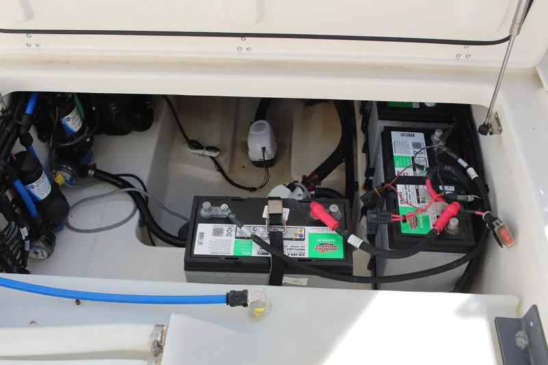 Slide: The Image of 2014 Boston Whaler 270 Vantage boat battery compartment with wiring and components. - 14