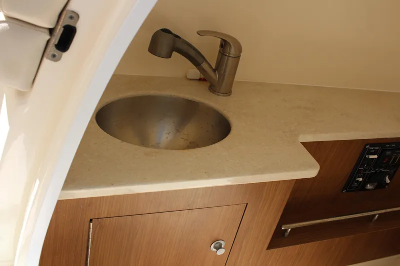 Slide: The Image of 2014 Boston Whaler 270 Vantage interior sink and countertop detail. - 16