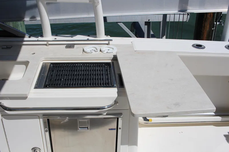 Slide: The Image of 2014 Boston Whaler 270 Vantage boat with onboard grill and prep station. - 3