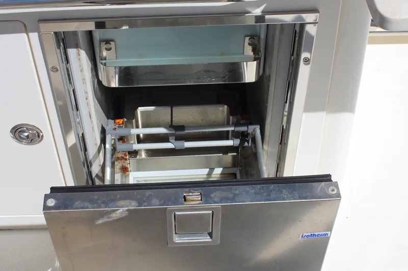 Slide: The Image of Open stainless steel drawer on 2014 Boston Whaler 270 Vantage boat. - 4