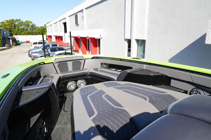 Slide: The Image of 2022 MTI 50V Center Console boat interior with modern seating and audio system. - 13