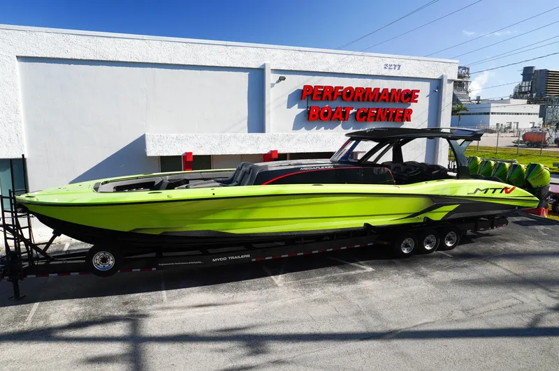 Slide: The Image of 2022 MTI 50V Center Console boat in vibrant green at Performance Boat Center. - 2