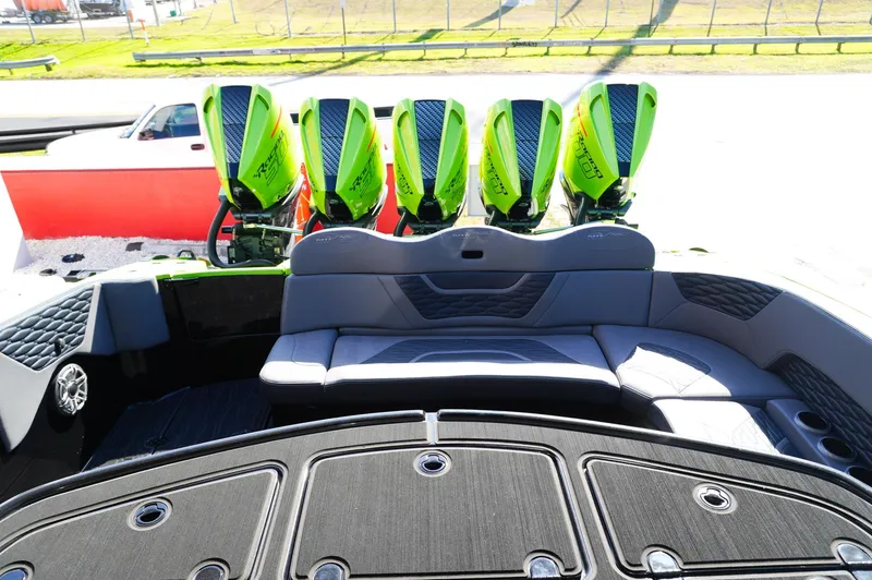 Slide: The Image of 2022 MTI 50V Center Console with five vibrant green outboard engines. - 21