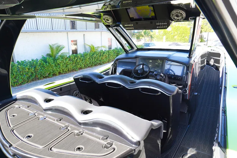 Slide: The Image of 2022 MTI 50V Center Console boat interior with sleek design and advanced dashboard. - 22