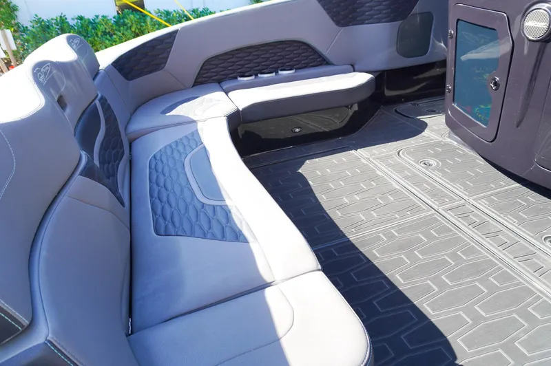 Slide: The Image of 2022 MTI 50V Center Console boat interior with cushioned seating and modern design. - 25