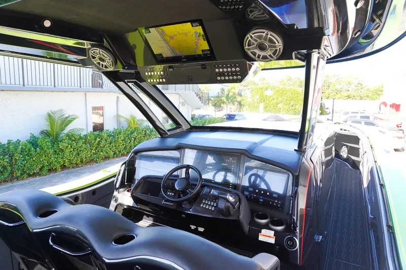 Slide: The Image of 2022 MTI 50V Center Console boat interior with advanced navigation system and sleek design. - 29