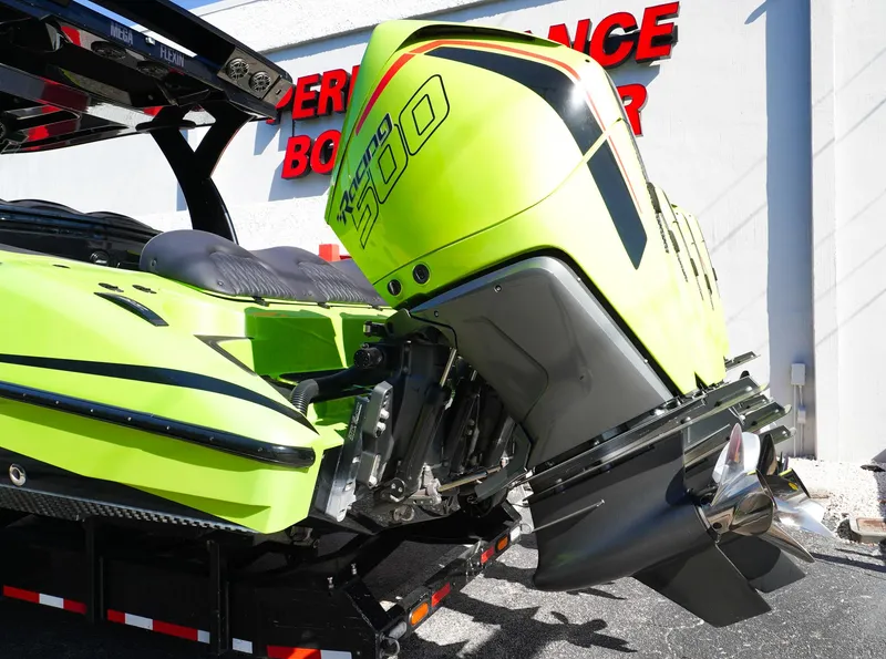 Slide: The Image of 2022 MTI 50V Center Console with vibrant green exterior and powerful outboard motor. - 35