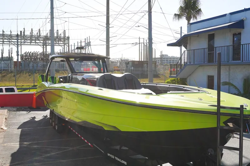 Slide: The Image of 2022 MTI 50V Center Console boat in bright green on a trailer. - 5