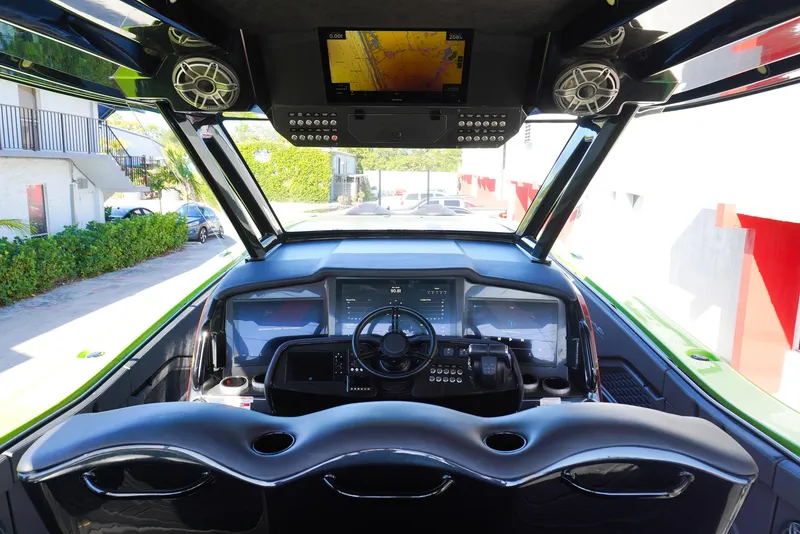 Slide: The Image of 2022 MTI 50V Center Console boat interior with advanced navigation system and sleek design. - 9