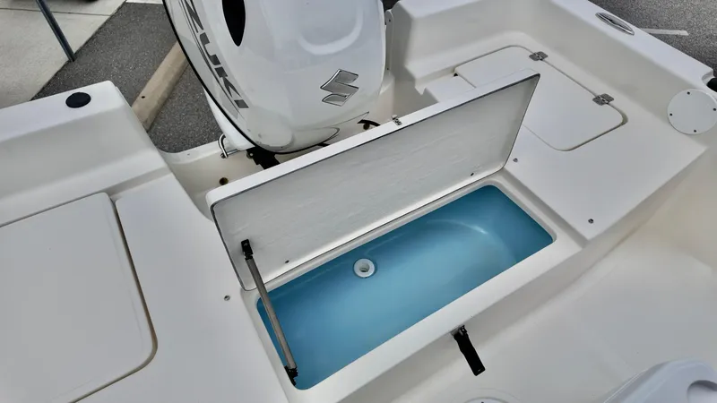 Slide: The Image of Bulls Bay 2000 boat, 2025 model, featuring an open storage compartment and outboard motor. - 9