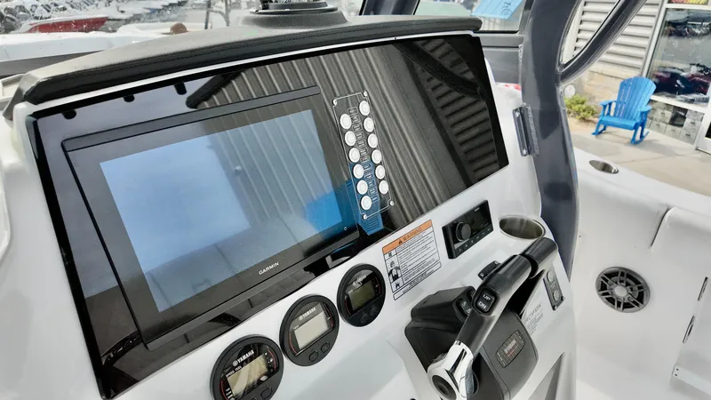 Slide: The Image of 2025 Sea Fox 268 Commander dashboard with modern controls and navigation display. - 12