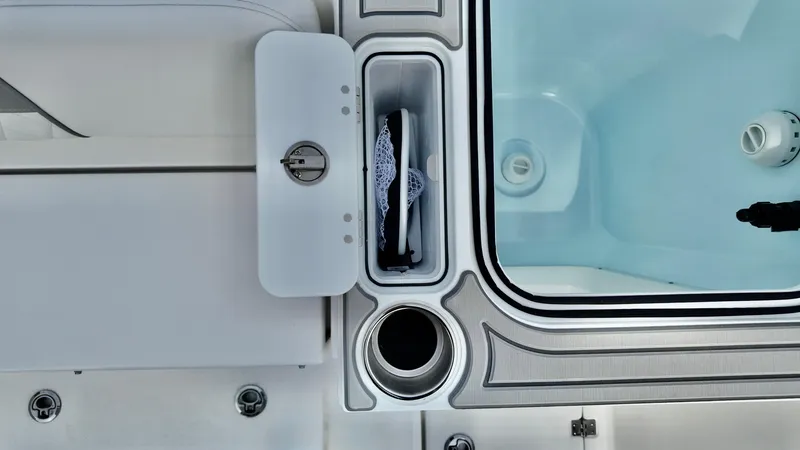 Slide: The Image of 2025 Sea Fox 268 Commander boat interior with storage compartment and cup holder. - 14