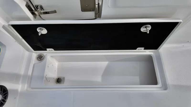 Slide: The Image of 2025 Sea Fox 268 Commander storage compartment with open lid, showcasing interior space. - 15