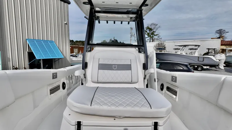 Slide: The Image of 2025 Sea Fox 268 Commander boat interior with white seating and modern design. - 19
