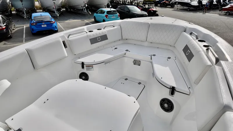 Slide: The Image of 2025 Sea Fox 268 Commander boat interior with white seating and storage compartments. - 7