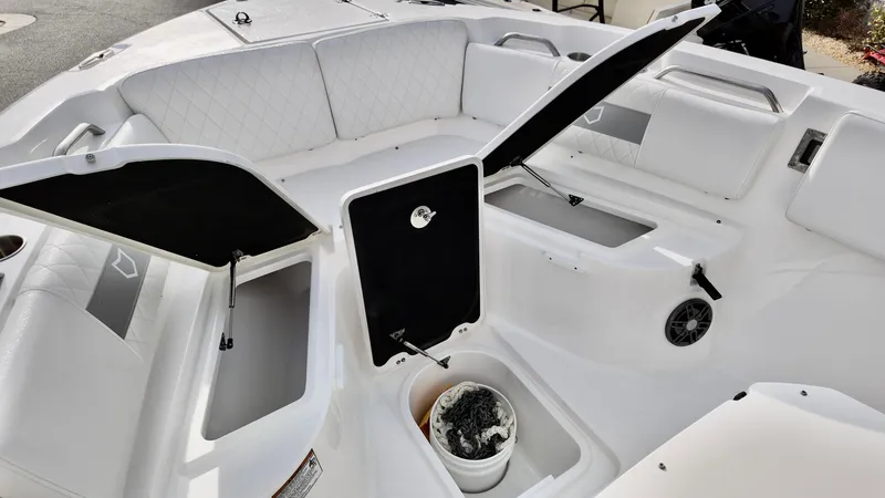 Slide: The Image of 2025 Sea Fox 268 Commander boat interior with open storage compartments and seating. - 8