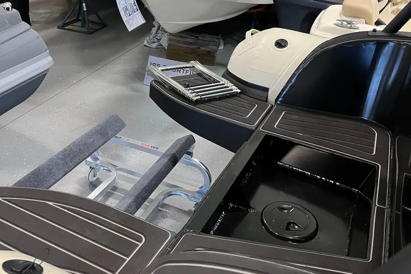 Slide: The Image of 2025 Highfield Sport 520 boat interior with storage compartments and sleek design. - 5