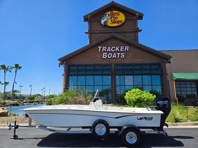 Slide: The Image of 2025 Mako Pro Skiff 17 CC boat on trailer outside Bass Pro Shops. - 0
