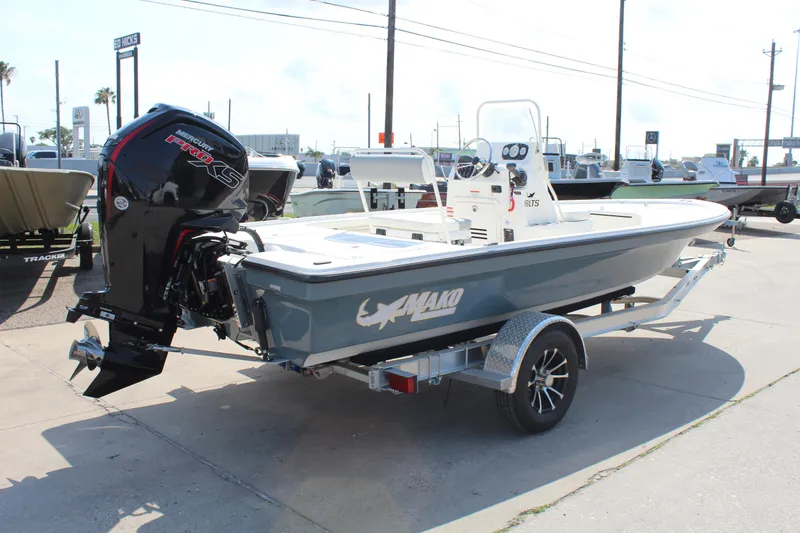 Slide: The Image of 2025 Mako 18 LTS boat on trailer, featuring a powerful outboard motor. - 5