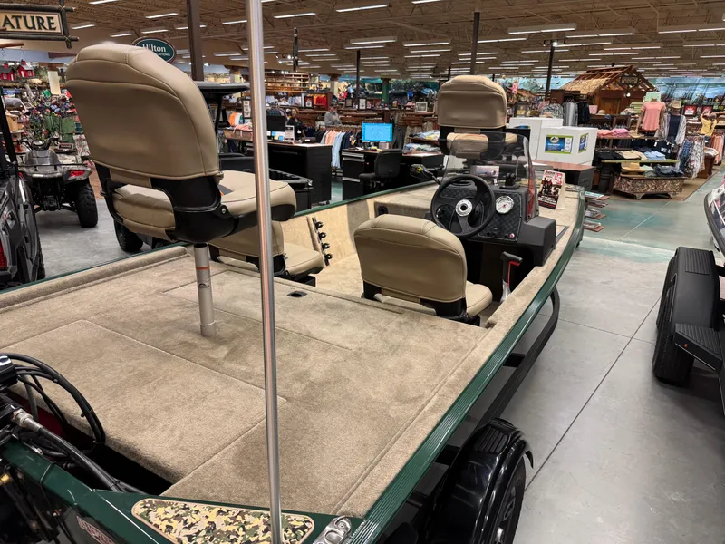 Slide: The Image of 2025 Tracker Bass Tracker Classic Limited boat displayed in a showroom. - 3