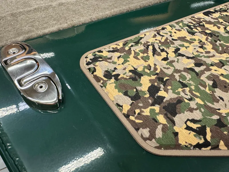 Slide: The Image of 2025 Tracker Bass Tracker Classic Limited with camouflage mat and metallic details. - 8