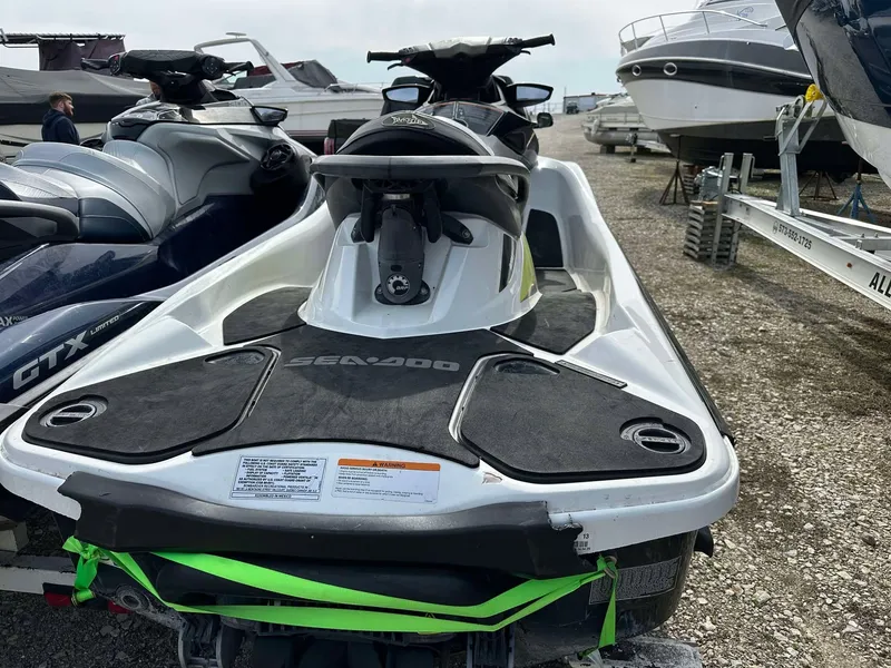 Slide: The Image of 2015 Sea-Doo Wake Pro 215 jet ski parked on gravel near boats. - 6