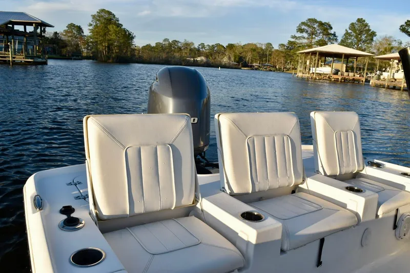 Slide: The Image of 2019 Sea Hunt BX 22 BR boat seats with scenic lake view. - 15