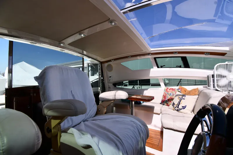 Slide: The Image of Interior of 2008 Savannah 54 EXPRESS yacht with plush seating and panoramic windows. - 22