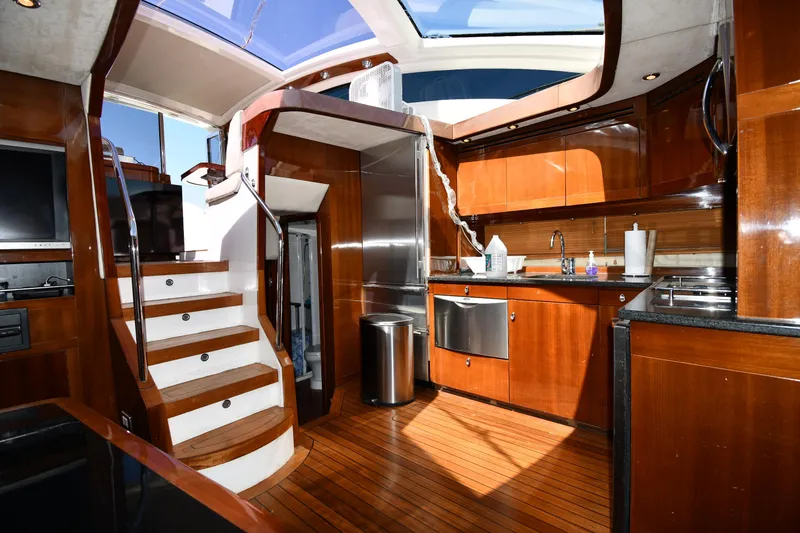 Slide: The Image of Luxurious interior of 2008 Savannah 54 EXPRESS yacht with wooden finishes and modern kitchen. - 36