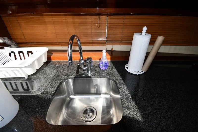 Slide: The Image of 2008 Savannah 54 EXPRESS yacht kitchen sink with granite countertop and accessories. - 38
